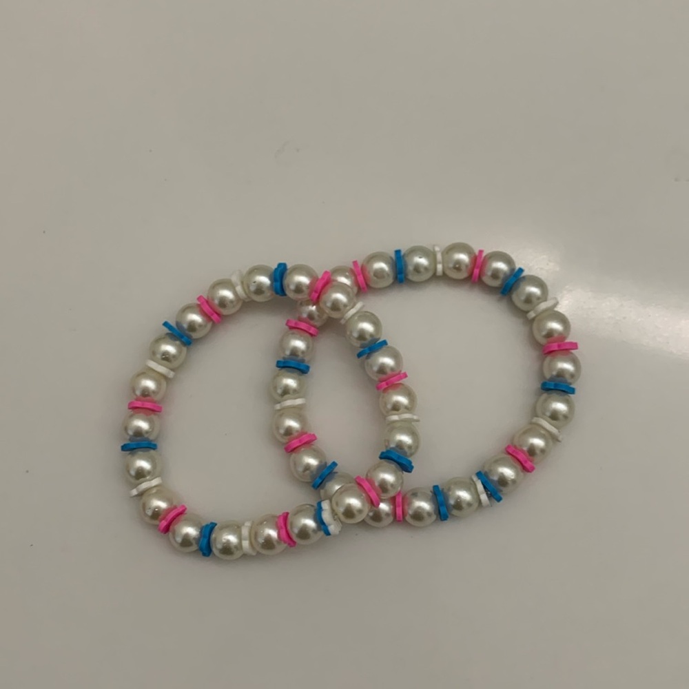 Two pink and blue flower pearls